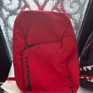 Nike Red Sporty Backpack with Streamlined Design